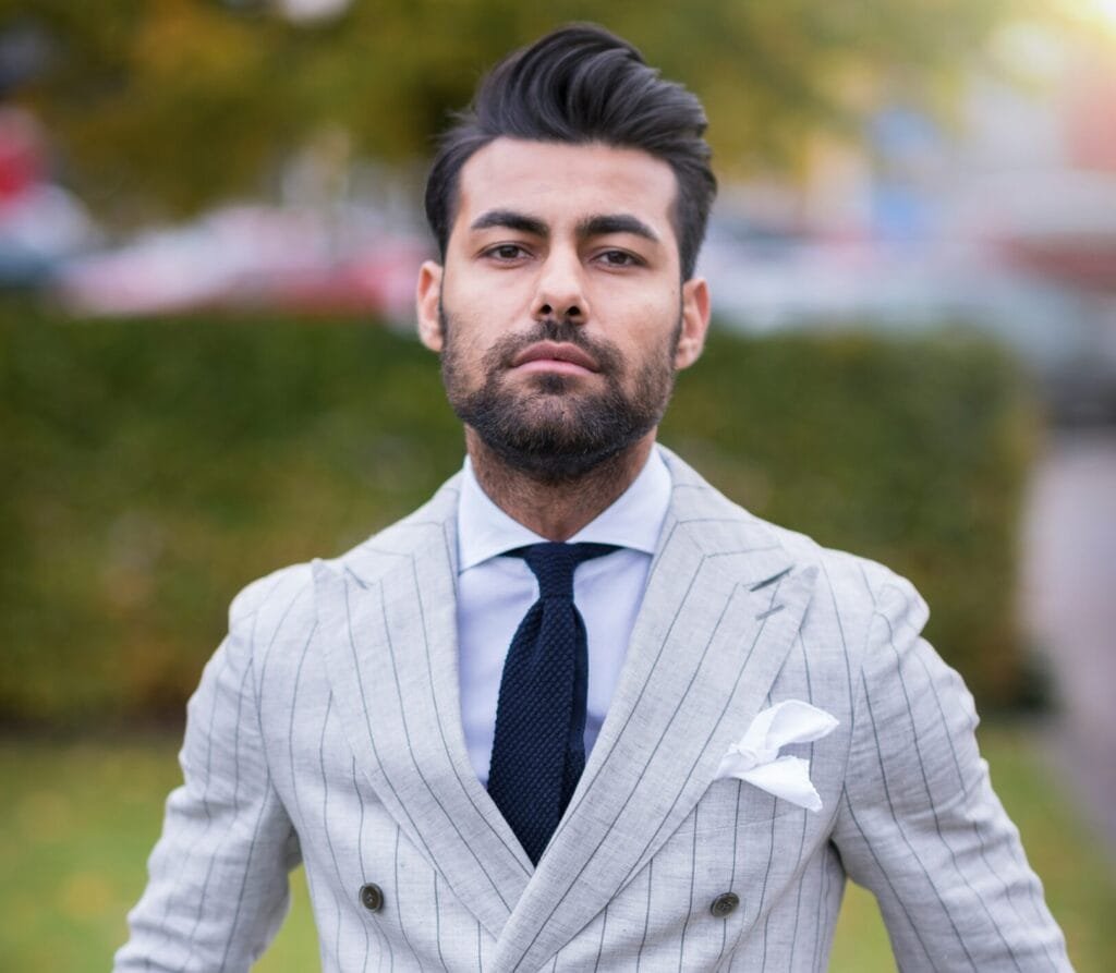 man in white and black pinstripe suit jacket