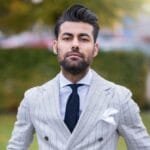 man in white and black pinstripe suit jacket