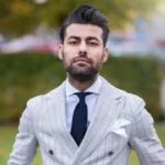 man in white and black pinstripe suit jacket